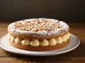 Dacquoise aux amandes et crème pâtissière. On peut faire une dacquoise la veille, elle sera parfaite pour ce gâteau !