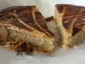Deux parts de galette des rois coco, avec leur feuilletage doré et leur garniture généreuse, prêtes à être dégustées.