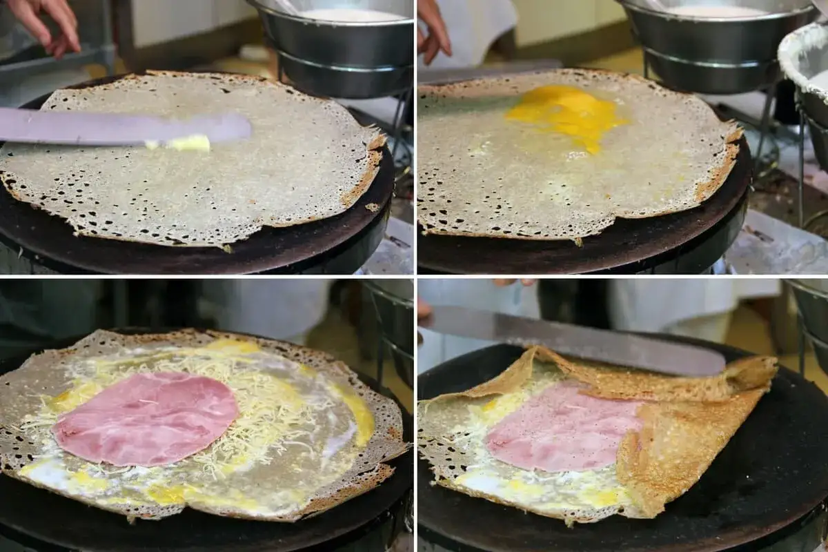 Pr&eacute;paration d'une galette de sarrasin : on y ajoute du beurre, un &oelig;uf, du fromage r&acirc;p&eacute; et une tranche de jambon avant de la plier.